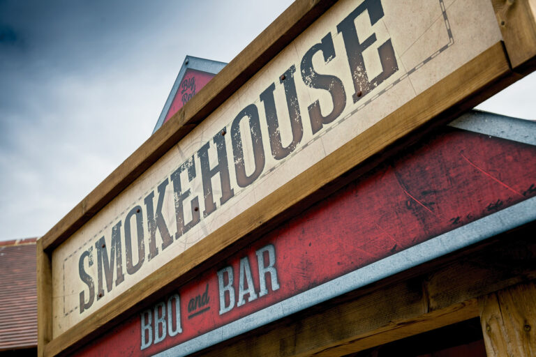 Close up of the external Signage at Smokehouse restaurant at Chessington World of Adventures